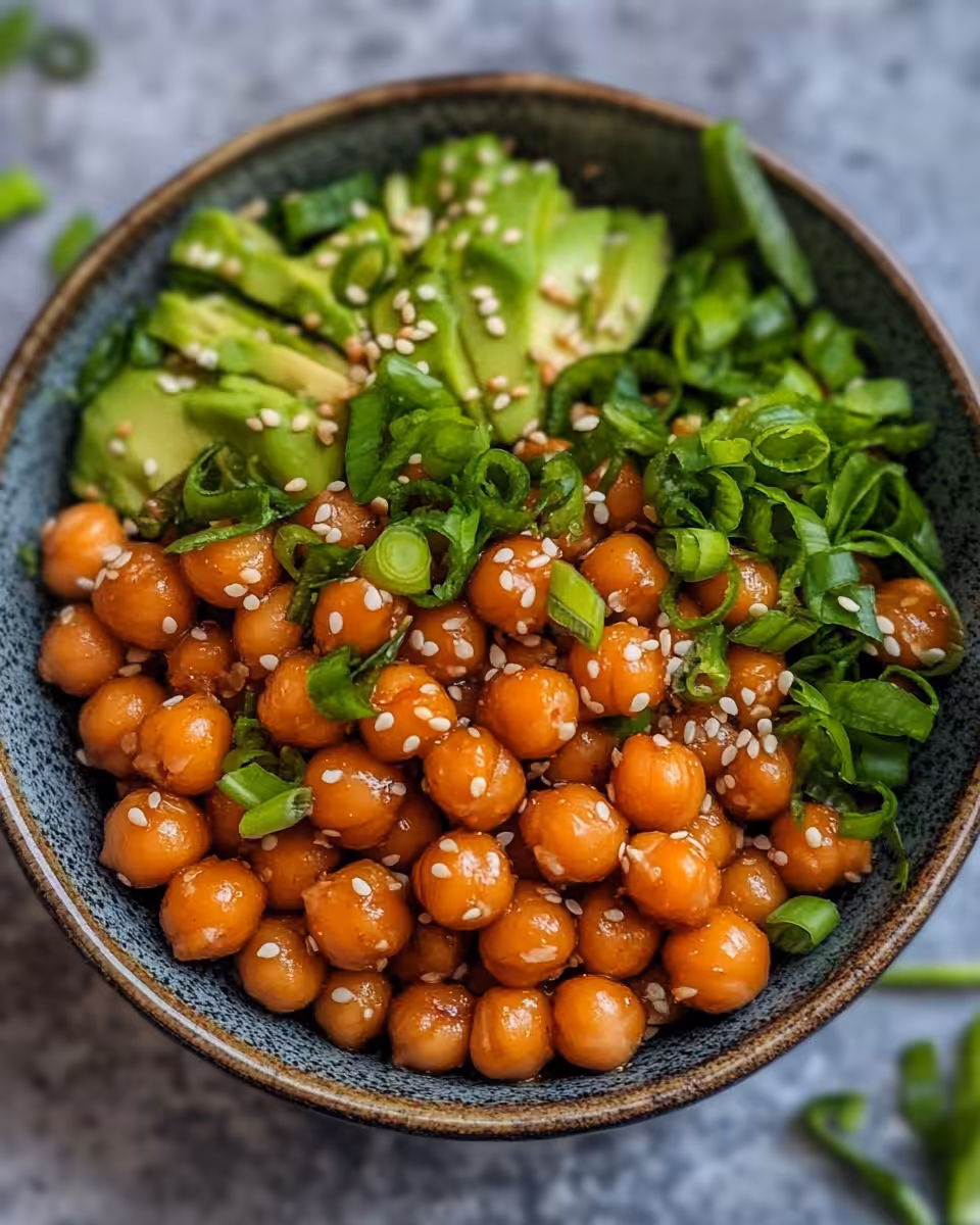 Cooking chickpeas with garlic and ginger in skillet