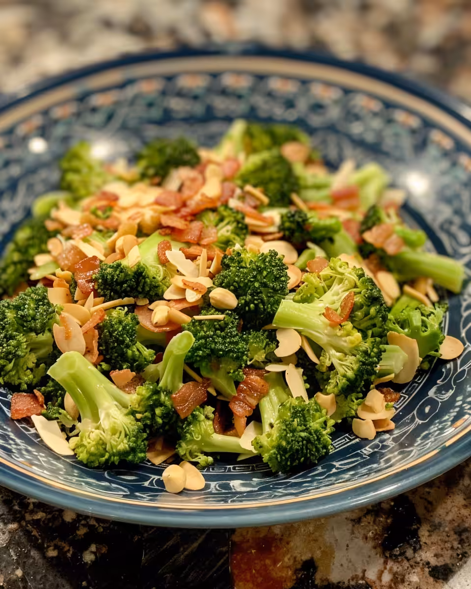 Fresh broccoli, cheese, and red onion salad ingredients in a bowl waiting to be pressure cooked